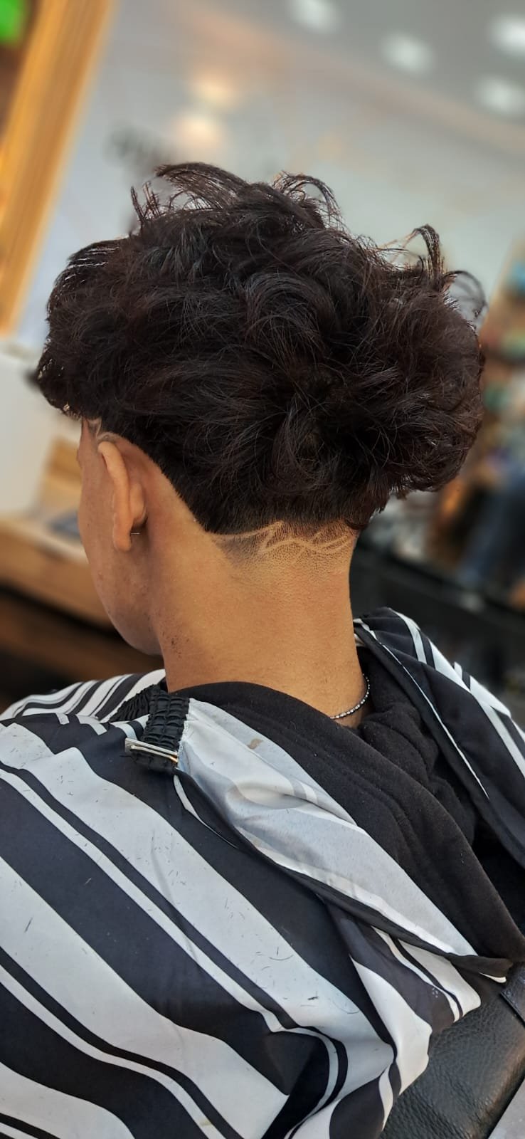 Corte fade de barbería realizado en Shekinah